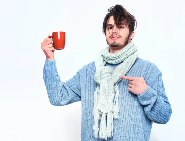 Handsome bearded man with cup in sweater and scarf — Stock Photo, Image