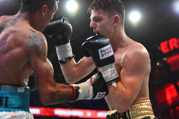 An unidentified boxers in the ring during fight for ranking points — Stock Photo, Image