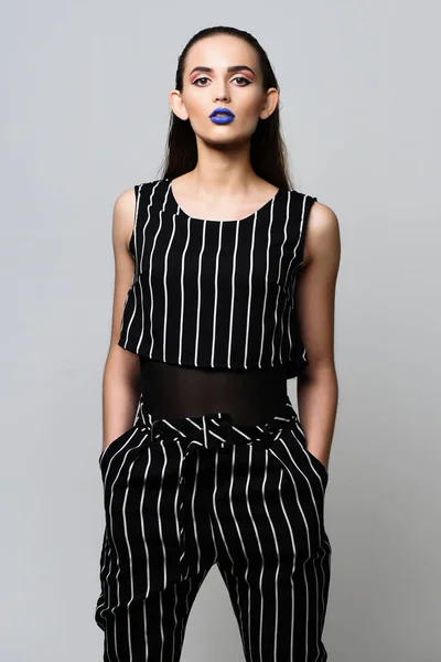 Pretty girl in striped suit with blue lips — Stock Photo, Image