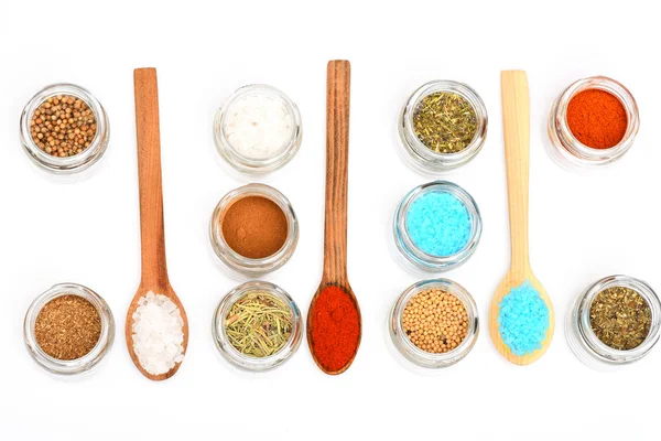 Various spices in spoons and jars on white background — Stock Photo, Image