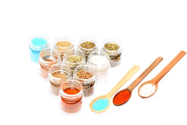 Various spices in spoons and jars on white background — Stock Photo, Image