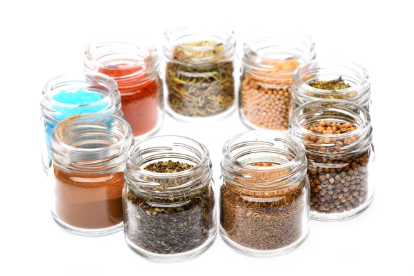 Various spices in jars on white background — Stock Photo, Image
