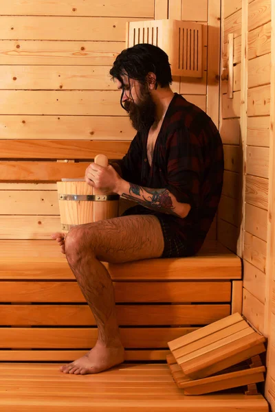Handsome bather in sauna