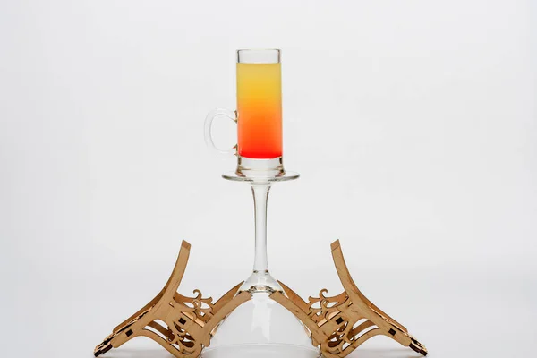 Alcohol cocktail sex on the beach on wineglass with chairs — Stock Photo, Image