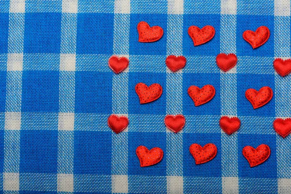 Valentines love symbol on blue plaid fabric, checkered cloth bac — Stock Photo, Image