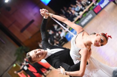 An unidentified dance couple in a dance pose during Grand Slam Standart at German Open Championship clipart