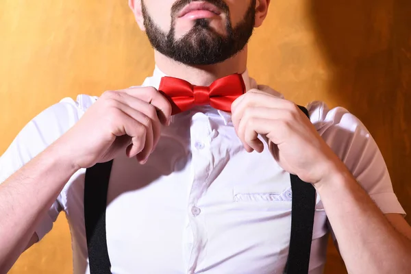 bearded man with serious face on studio wall background