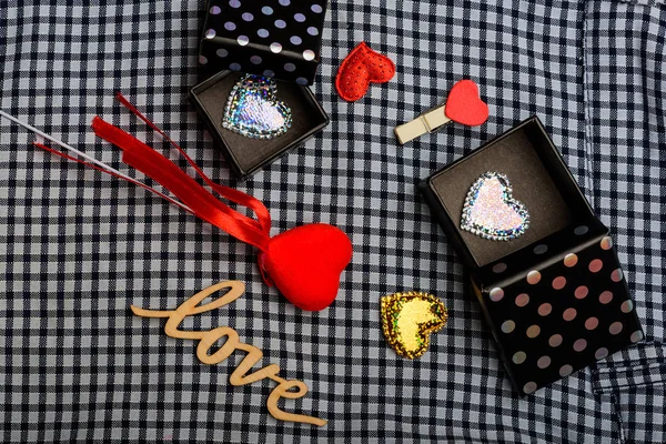 valentine decorations with hearts, word love and present boxes