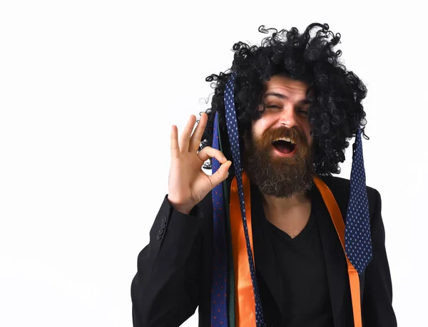 Caucasian hipster in suit and black curly wig — Stock Photo, Image