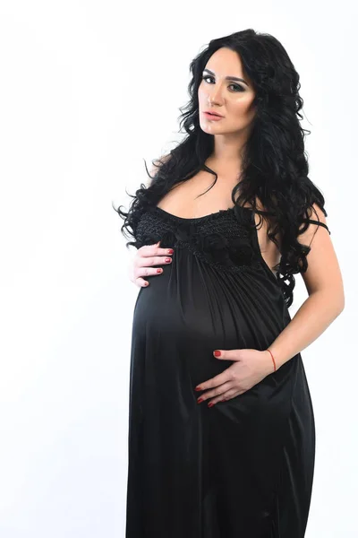Csinos terhes nő simogatja a hasát. — Stock Fotó