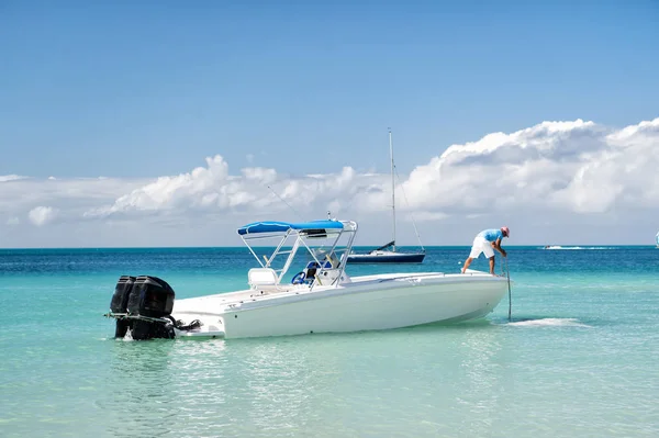 Man, yachtsman on motorboat on water, in St. John, Antigua — Stock Photo, Image