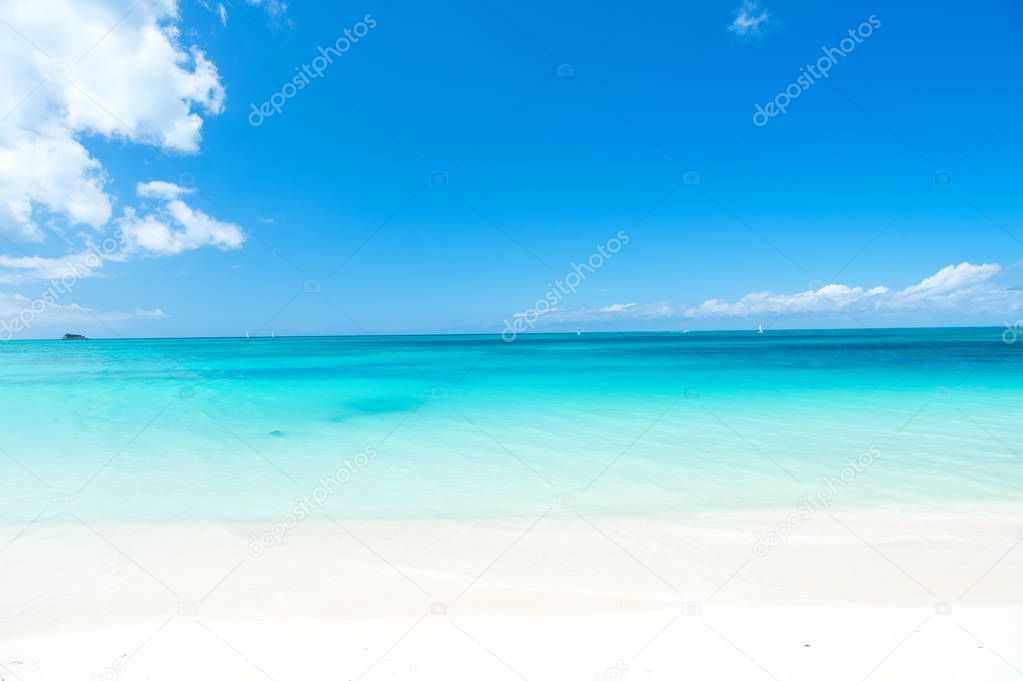 wavy sea, ocean water background on sand coast in Antigua