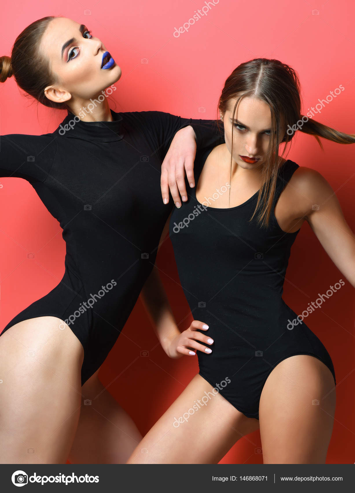 Two pretty girls with red and blue lips in bodysuits Stock Photo by  ©stetsik 146868071