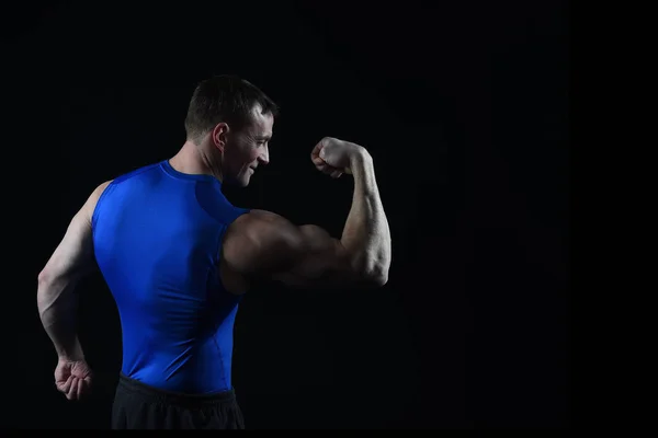 Handsome bodybuilder man with muscular body training in gym Stock Photo by  ©stetsik 239143980