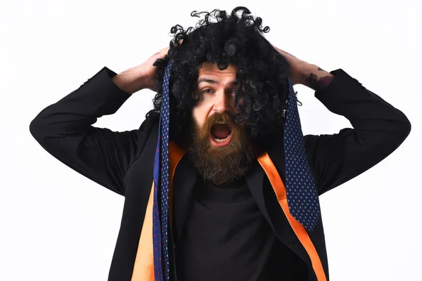 Caucasian hipster in suit and black curly wig — Stock Photo, Image