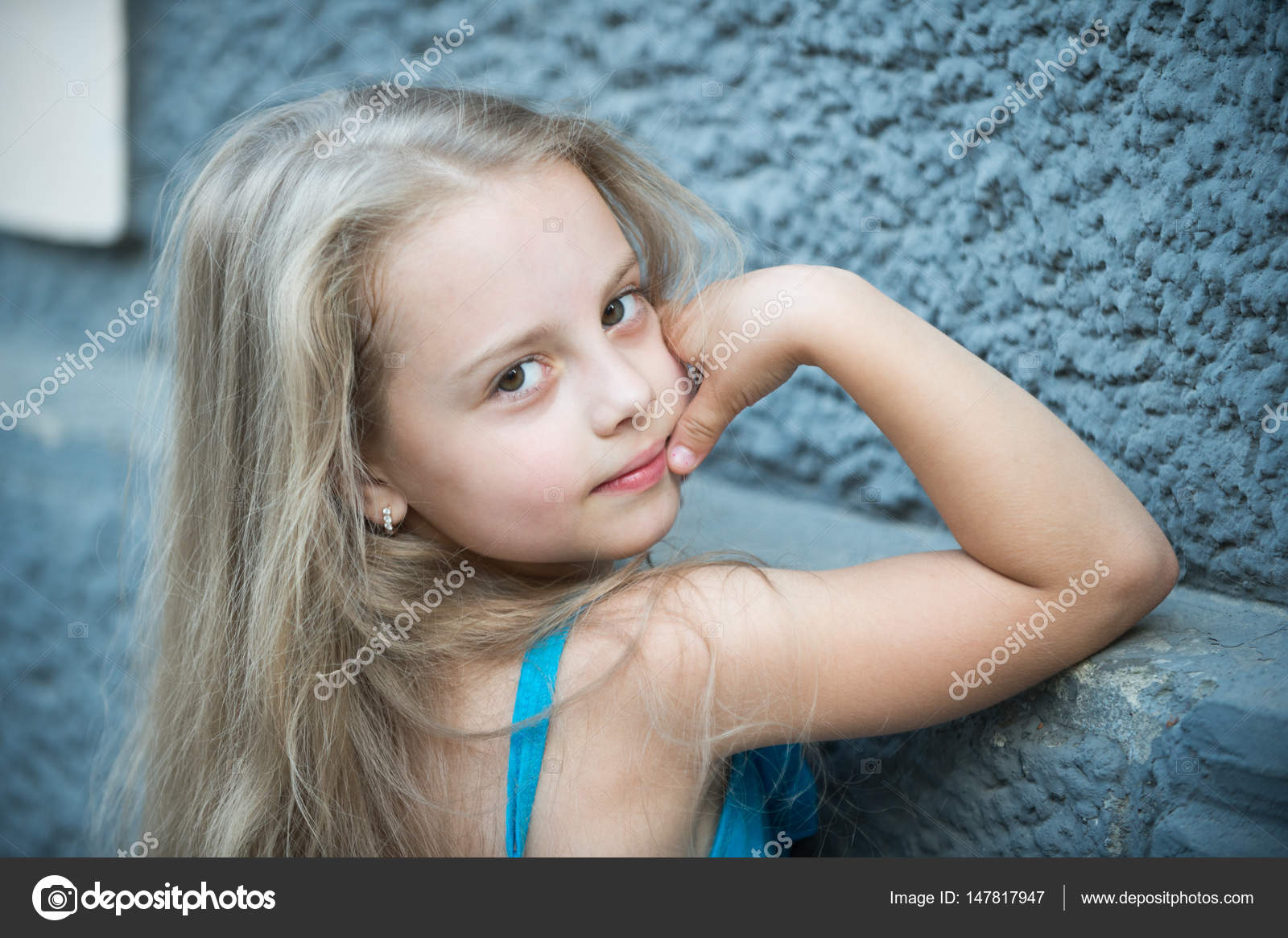 Small baby girl with long blonde hair outdoor Stock Photo by ©stetsik  147817947