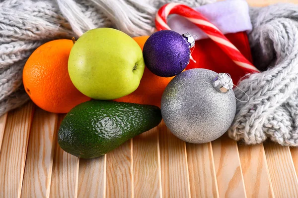 Various fruits: lemon, apple, orange, avocado on wooden table Stock Picture