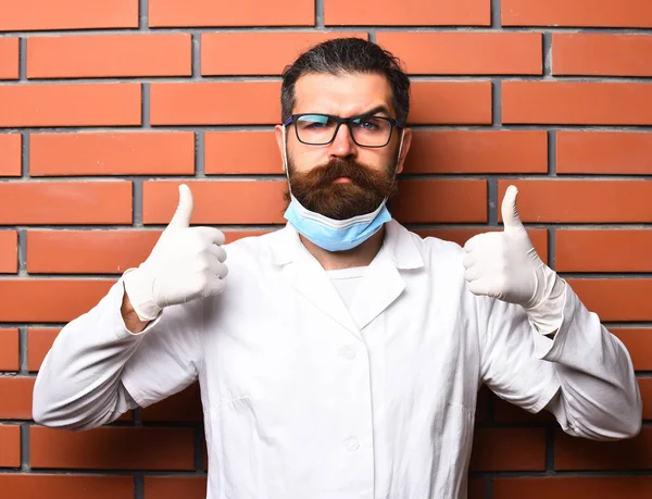 Bearded brutal caucasian doctor or postgraduate student in gloves — Stock Photo, Image
