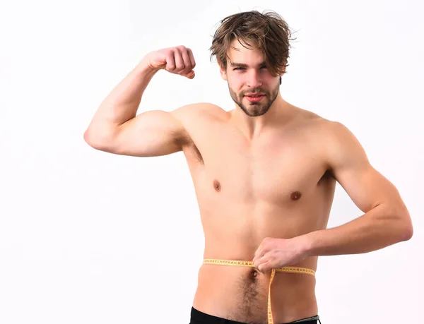 Caucásico sexy joven macho utiliza cinta métrica —  Fotos de Stock