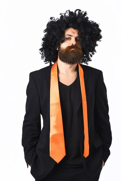Caucasian hipster in suit and black curly wig — Stock Photo, Image
