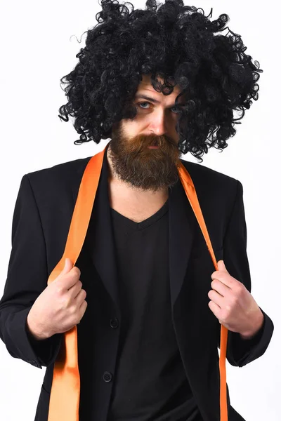 Caucasian hipster in suit and black curly wig — Stock Photo, Image