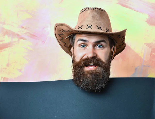 Bearded brutal caucasian hipster cowboy