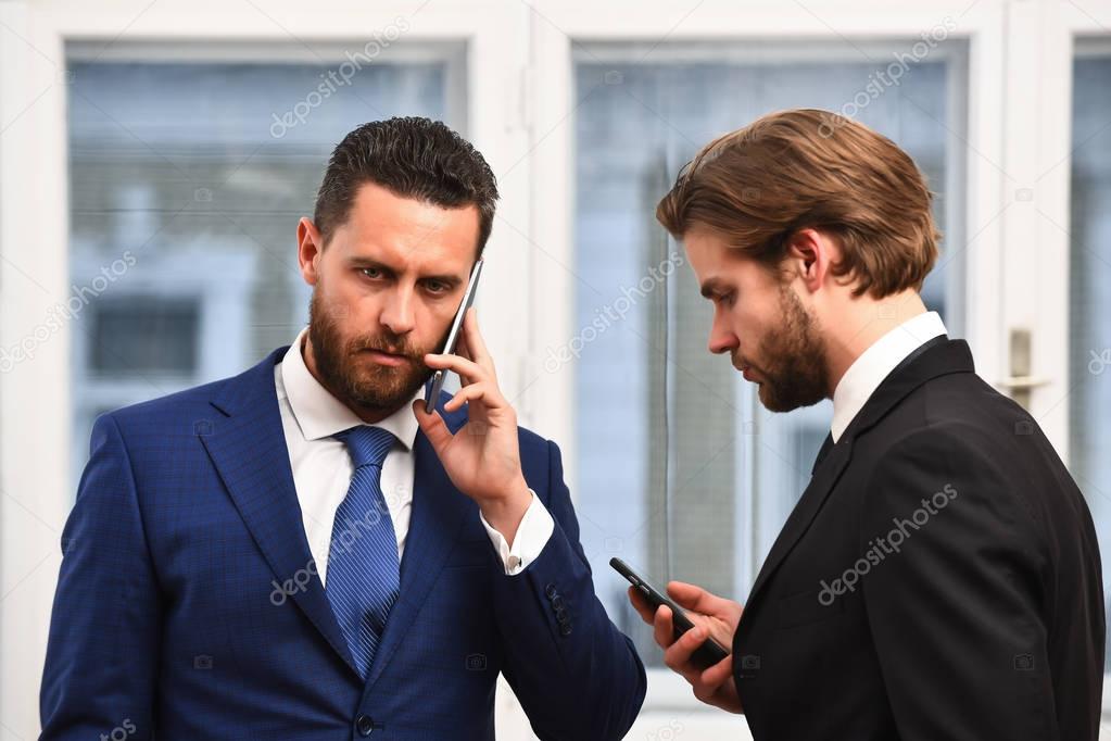 Office workers talking by phone. Business concept