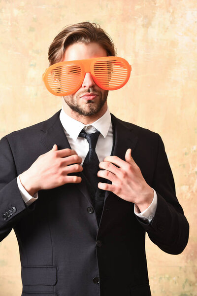 Manager in elegant black business suit in party glasses