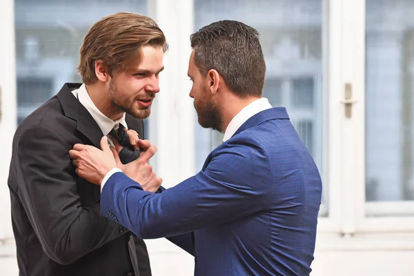 Fight, business conflict, confident men or businessmen fight with tie — Stock Photo, Image