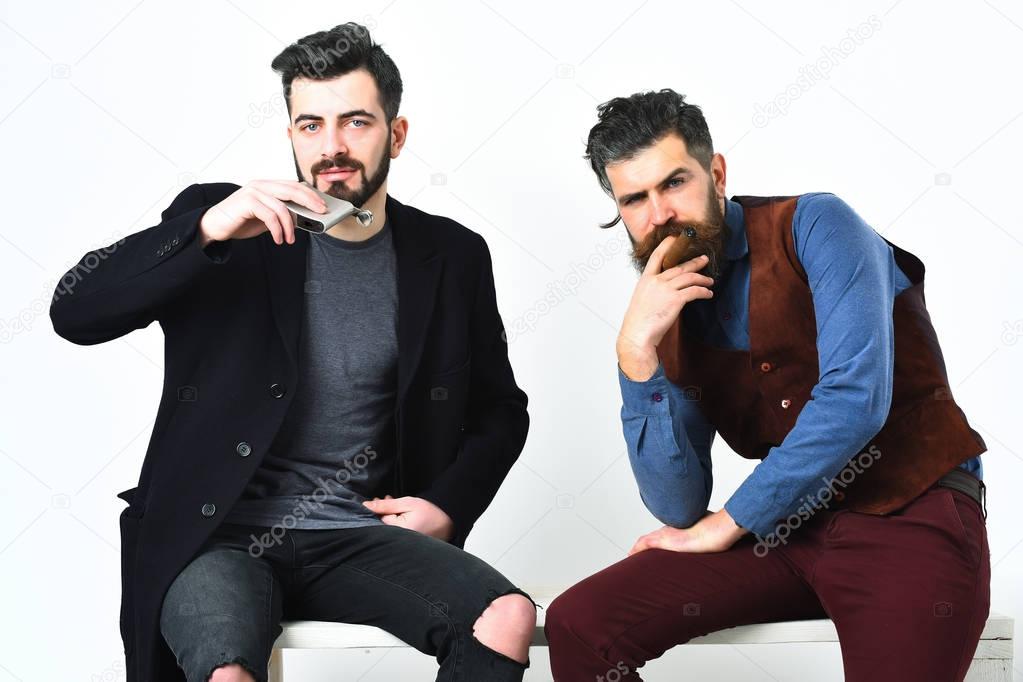 Two bearded mens, caucasian stylish hipsters with moustache