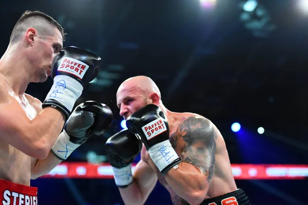 An unidentified boxers in the ring during fight for ranking points — Stock Photo, Image