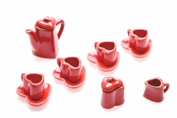 Conjunto romántico rojo de pequeños utensilios de cocina en forma de corazón rojo —  Fotos de Stock