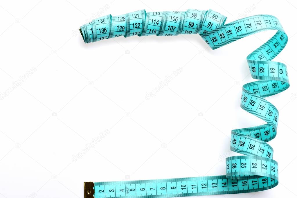 Roll of cyan measuring tape untwisted in abstract form