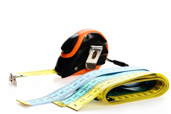 Rulers for sewing and self retracting tape measure — Stock Photo, Image