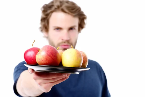 Gezicht expressie van sterke en zelfverzekerde man aanbieden van appels — Stockfoto