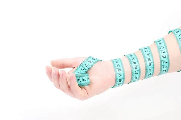 stock image Hand of woman with flexible ruler, which ties around arm