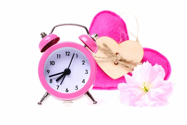 Alarm clock and soft handmade toy heart in pink colour — Stock Photo, Image