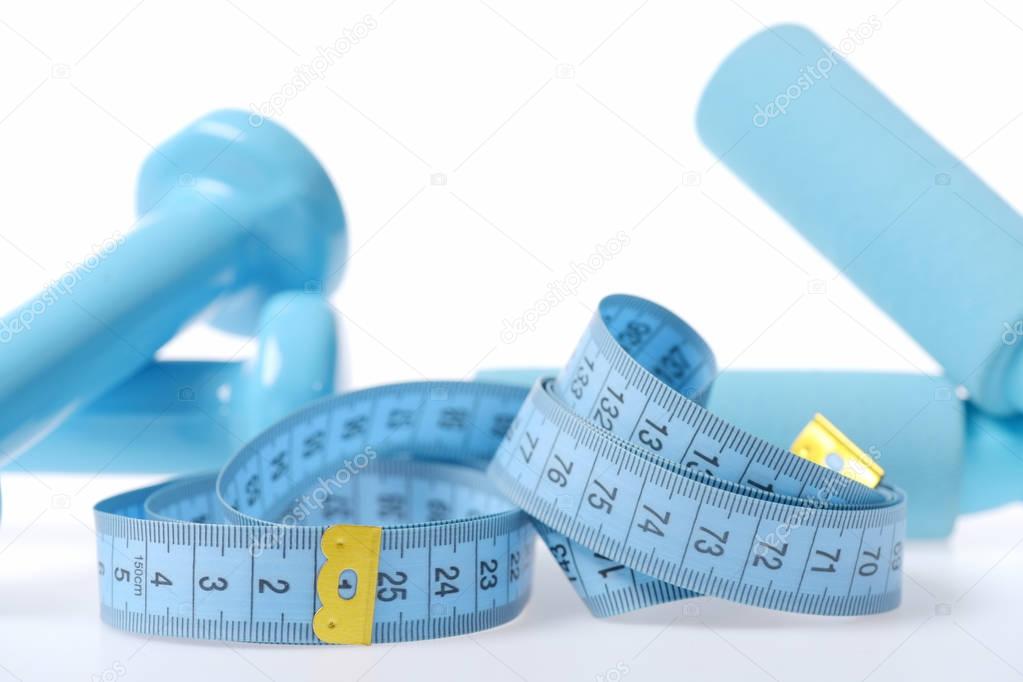 Tape for measuring in cyan colour with dumbbells and handles