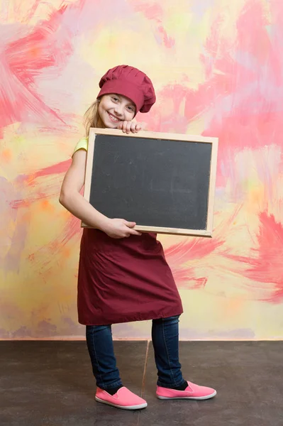 Baby, happy kid with banner board in kitchen or restaurant — Stock Photo, Image