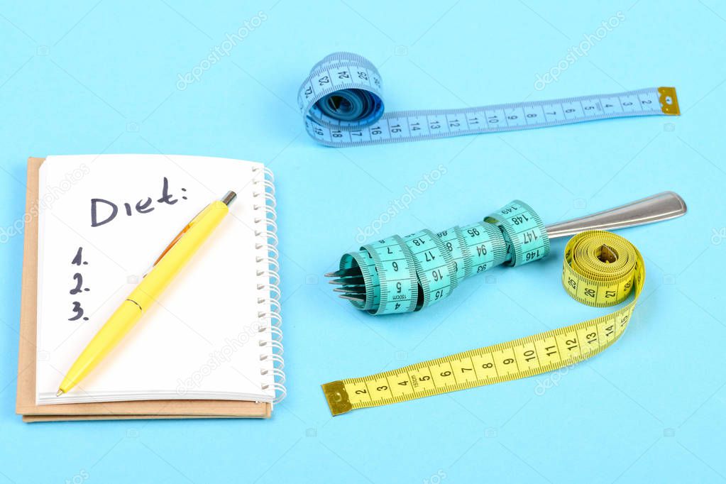 Tapes for measuring and notebook with diet plan