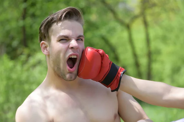 Man punched in face with boxing glove — Stock Photo, Image