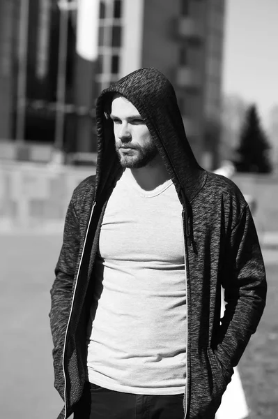 man sport fashion, bearded guy model in black hoodie