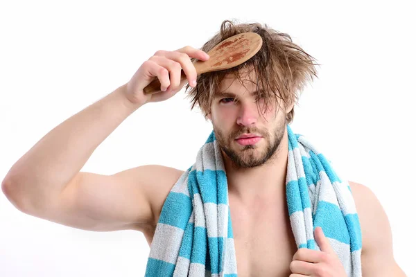 Tidiness and morning time idea. Guy with striped blue towel — Stock Photo, Image