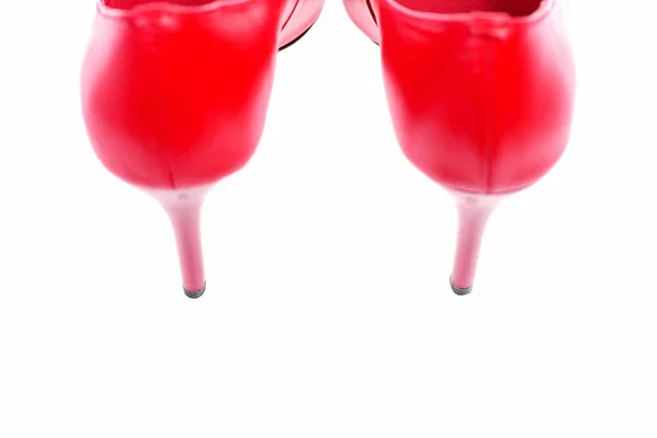 Beyaz arkaplanda izole edilmiş bir çift kırmızı ayakkabı — Stok fotoğraf