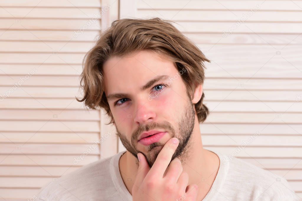 Macho with fair beard and serious face