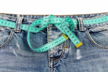 Healthy lifestyle and dieting concept: measure tape fastened aro clipart
