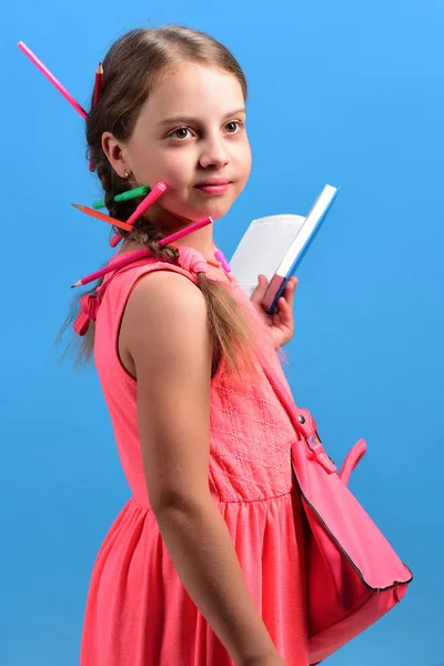Back to school and education concept. Girl with serious face — Stock Photo, Image