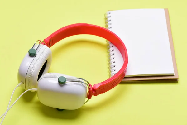 Modern and stylish earphones on yellow background — Stock Photo, Image