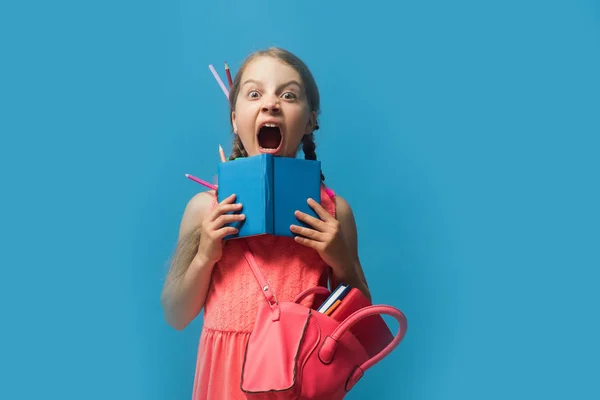 Back to school and childhood concept. Kid with scared face — Stock Photo, Image