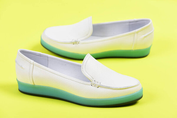 Moccasins for women in white color. Summer fashion, casual lifestyle